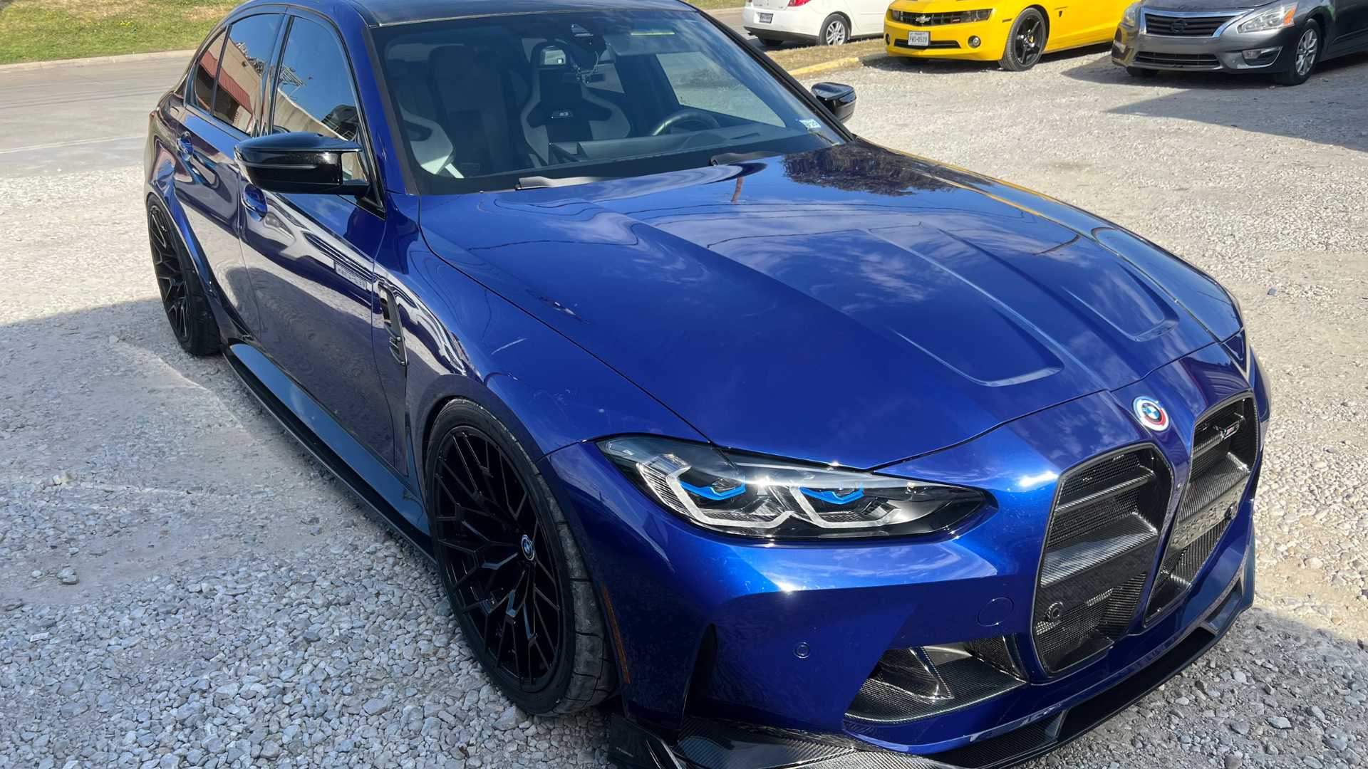 Vehicle with a new set of custom wheels and a fresh, glossy paint application.