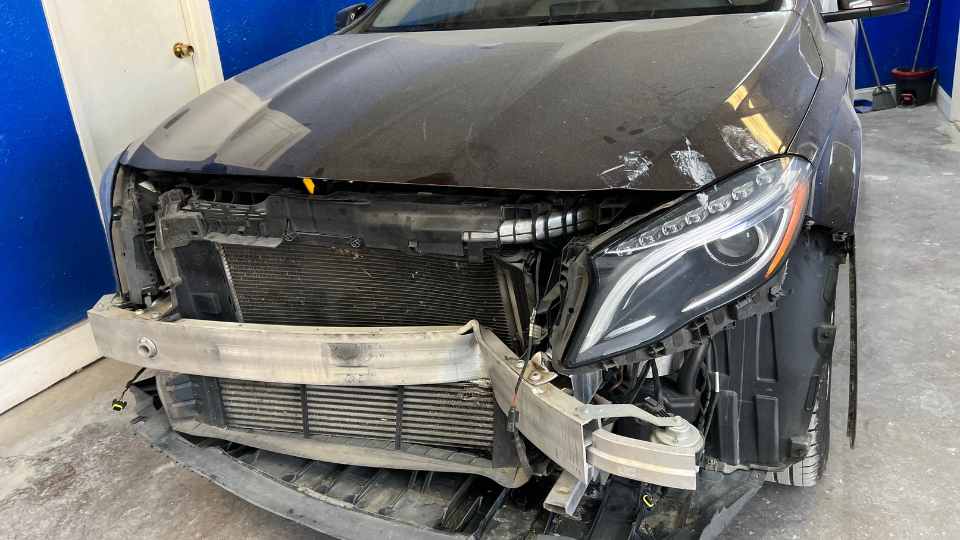 After repair: New hood installation with factory-aligned front-end and paint matching