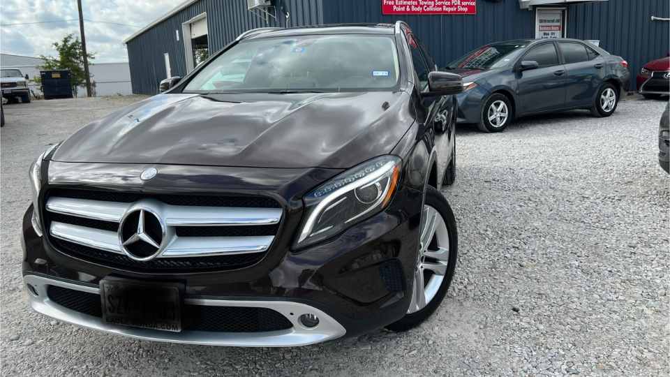 Before repair: Severely damaged hood and misaligned front-end after an accident