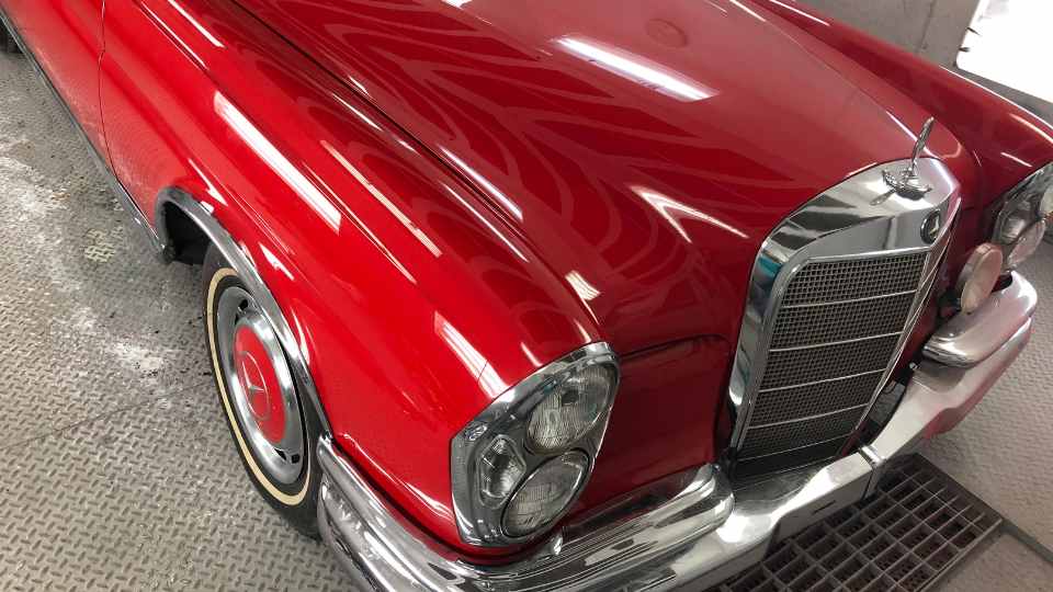Before repair: Smashed front bumper and damaged classic car grille from collision in Garland, TX