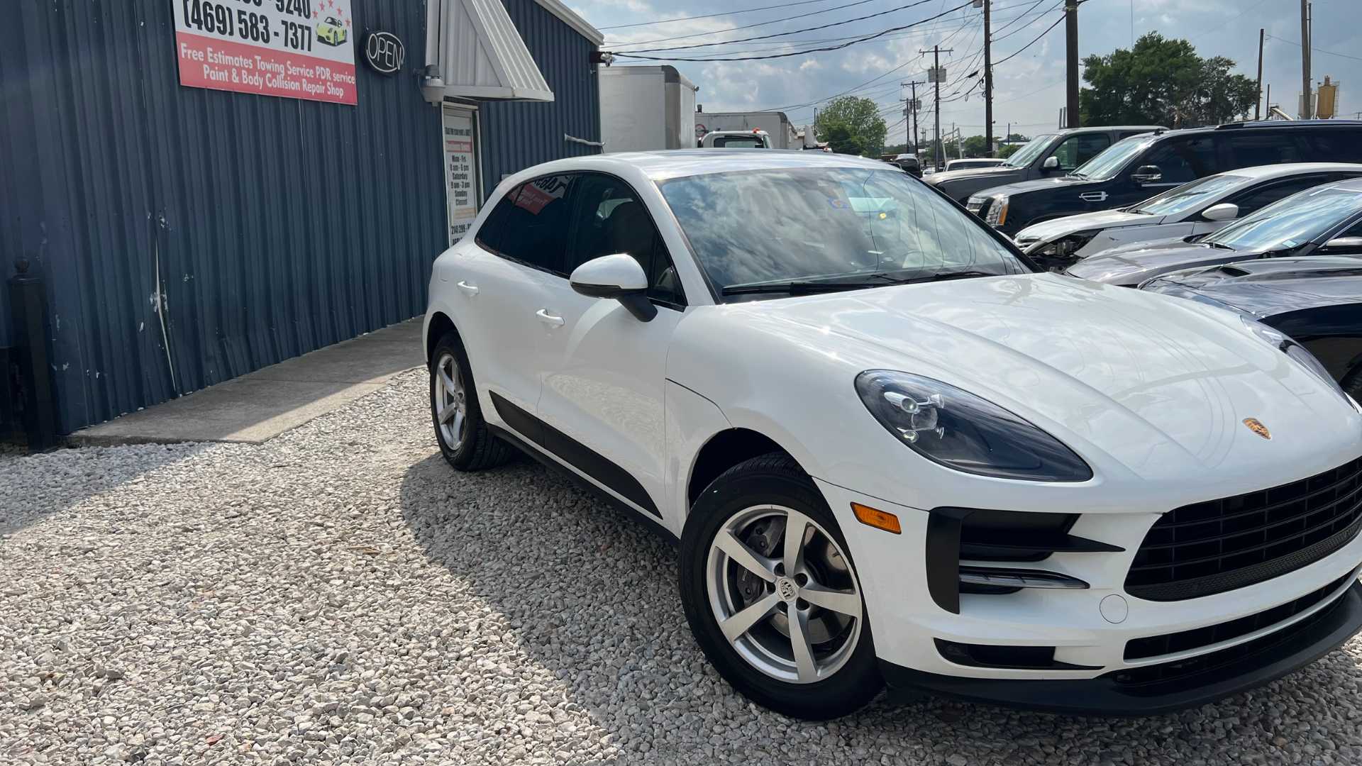 White sports car after paintless dent repair.