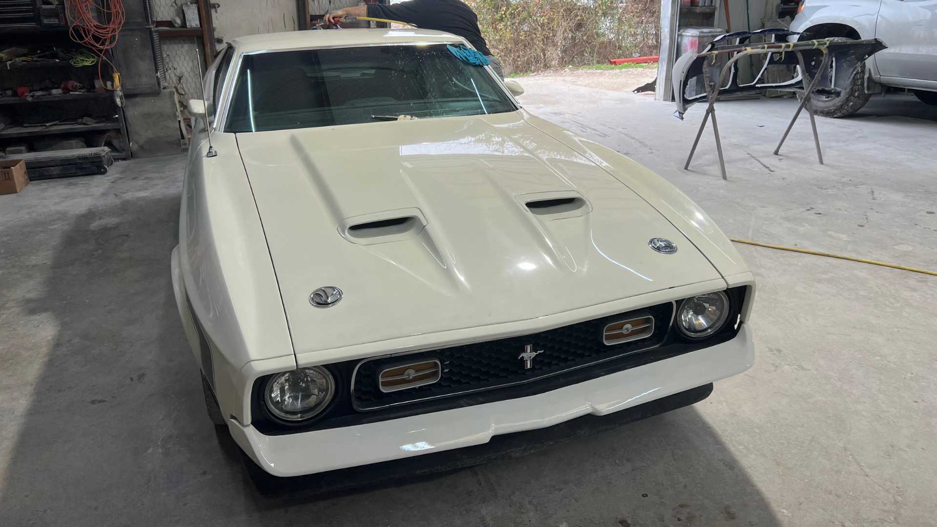 Luxury sports car receiving a final polish.